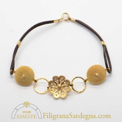 Bracciale con corbule e fiore in filigrana d'oro