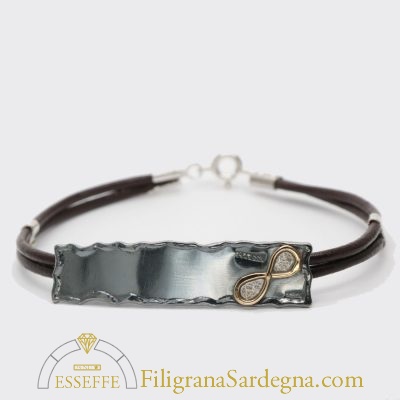 Bracciale con lastra brunita e ionfinito in or