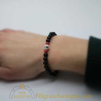 Bracciale con sfere d'onice corallo e vago in filigrana