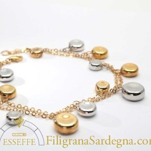 Bracciale in oro con charms in oro giallo e bianco