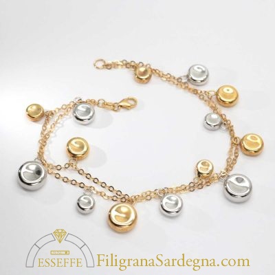 Bracciale in oro con charms in oro giallo e bianco