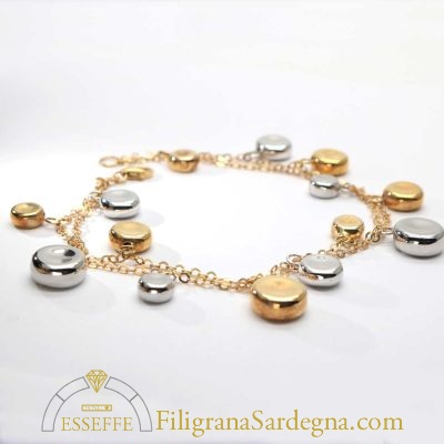 Bracciale in oro con charms in oro giallo e bianco