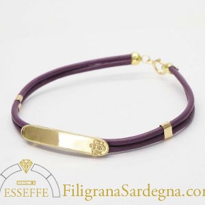 Bracciale in pelle e lastra d'oro con fiore in filigrana