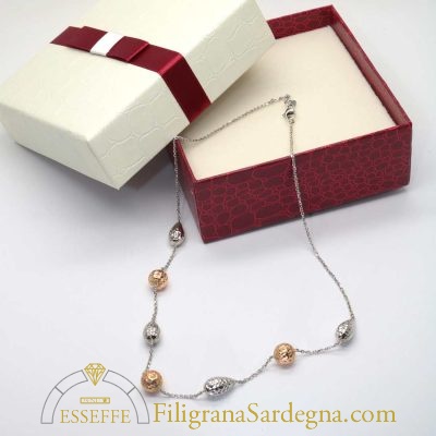 Collana oro bianco con intercalari a goccia e a sfera in oro rosso