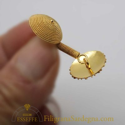 Gemelli in oro con pintadera e corbula